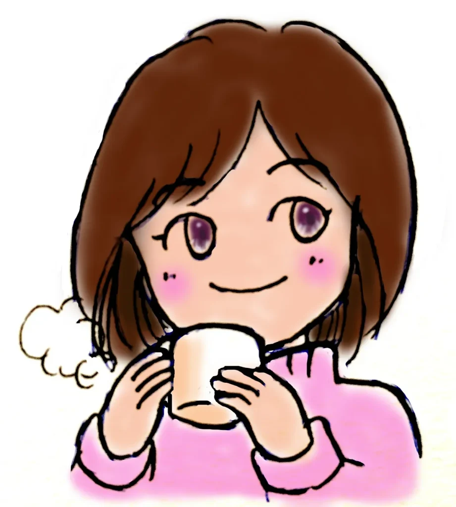 暖かい飲み物を飲む女性